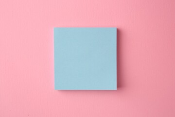 Fototapeta na wymiar Blank paper note on pink background, top view