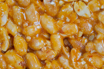 Top view: Gozinaki - caramelized nuts fried in honey - orange granola peanut bar - close up, macro. Traditional Georgian cuisine, gastronomy, oriental sweet and food concept