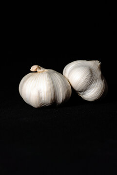white garlic with black background, food and seasoning, garlic
