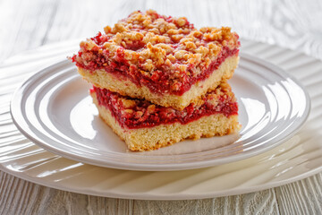 Raspberry Crumble Bars on white plate, top view