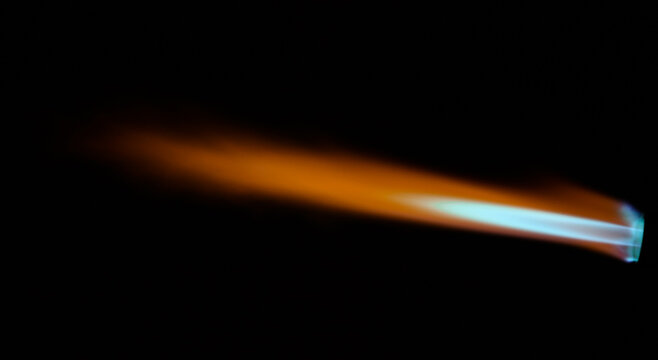 Flame of gas torch over black background