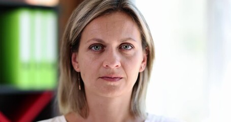 Beautiful woman peels off tape from mouth