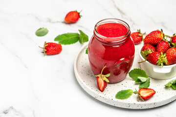 Jar of strawberry jam on white background. Homemade strawberry marmelade and fruits. Long banner format