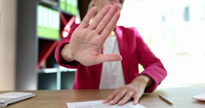 Hand of business woman refuses contract. Customer rejection gesture