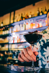 man hand bartender making cocktail in glass on the bar counter