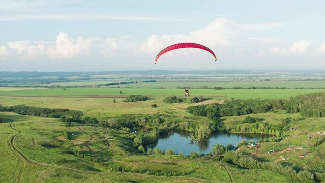 Southern Urals, a paramotor flies over Tugar-Salgan Lake. Aerial view.