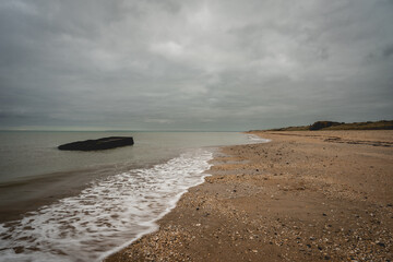 Old shipwrech from world war Two, at the coast of Utah Beach, France.