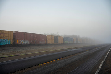 Naklejka premium freight cargo train railroad track side of road