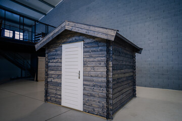 New pinewood shed on factory. black painted storage hut.
