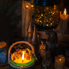 Illustration of magical stuff....candle light, magic wand, book of spells dark background, magic school, dark aesthetic, Halloween time