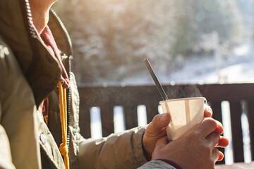 Man with a glass of hot drink