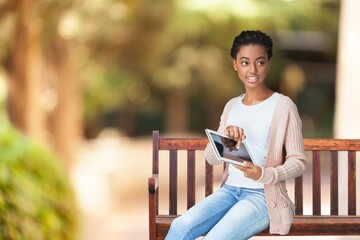 Creative young person works on tablet computer