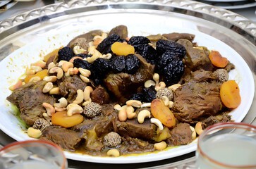 Moroccan meat dish with prunes and almonds