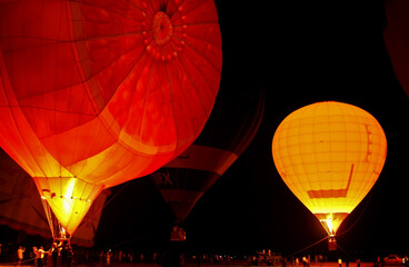 A hot air balloon lit up the night sky.  