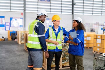 Warehouse worker standing talking discussion during break time in goods storage area