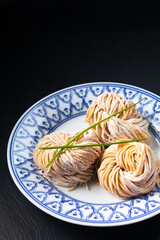 Asian food concept frech homemade organic Chinese Alkaline egg noodles on black background with copy space
