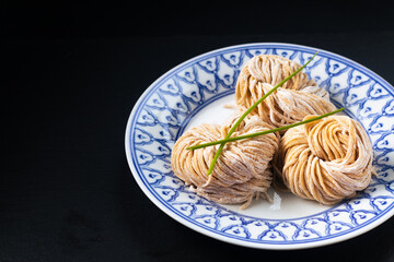 Asian food concept frech homemade organic Chinese Alkaline egg noodles on black background with copy space