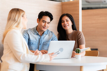 Young students researching inventions with modern technology in university libraries..