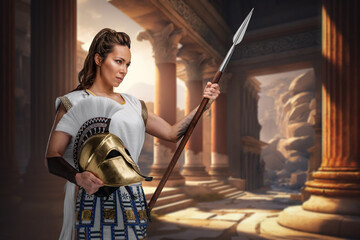Fototapeta na wymiar Portrait of warrior woman dressed in white tunic holding spear.