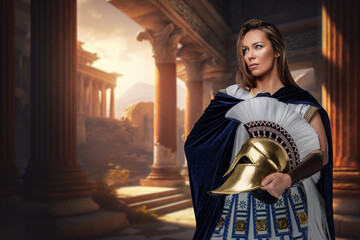 Fototapeta na wymiar Shot of female greek general dressed in cloak and tunic against ancient building.
