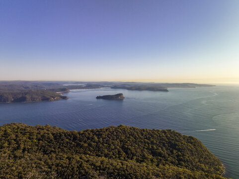 Beautiful evening aerial drone view of Lion Island, Pearl Beach, Umina, Box head and the Central Coast seen from above West Head near Palm Beach, Northern Beaches, Sydney, New South Wales, Australia.