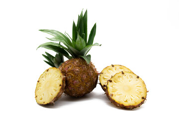 whole and slice pineapple with leaves isolated on white background, Flat lay.selective focus