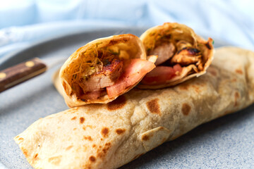 Two fresh chicken and salad tortilla wraps