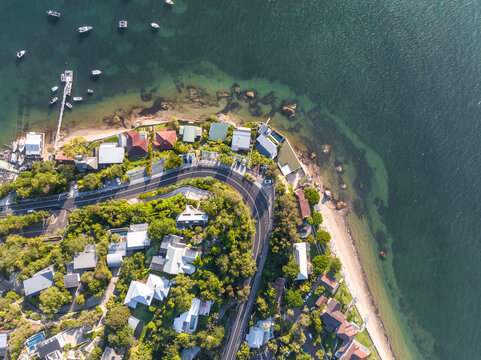 High angle aerial evening bird's eye view of Palm Beach coastline and the ferry Wharf . Palm Beach is an affluent beachside suburb in the Northern Beaches region of Sydney, New South Wales, Australia.