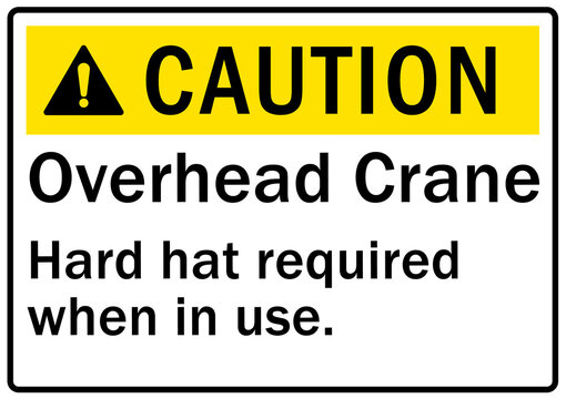 Overhead crane hazard sign and labels hard hat required when in use