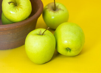 apple isolated on yellow background. Clipping path. Fresh organic apple