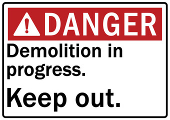 Demolition in progress warning sign and labels keep out