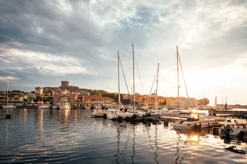 Foto auf Acrylglas Summer sunset over Sweden's sailing capital on the Swedish West Coast in Marstrand, Sweden. © PhotosbyPatrick