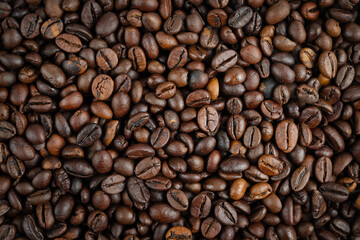 Roasted coffee beans background. Top view, close up