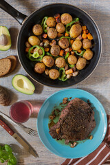 Traditional lunch American cooking grilled steak and various vegetables