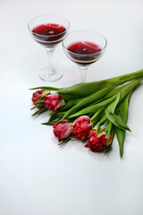 Bouquet of tulips and glasses of wine