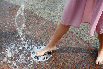 Feet in the fountain. Barefoot