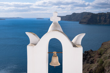 Bell Tower of a church of Oia village on Santorini island, Greece.  Beautiful architecture in the...