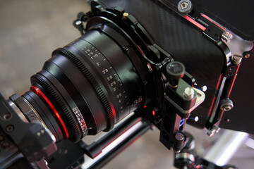 Fototapeta na wymiar professional cine lens mounted on professional movie camera with compendium