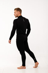 A man with a sporty physique in thermal underwear.