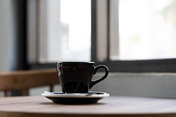 Hot latte coffee in a cup on the table