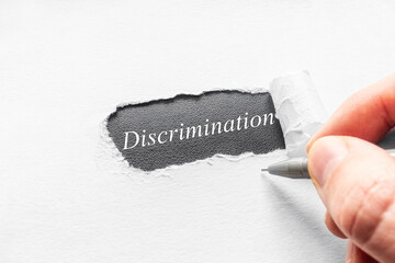 writes the word discrimination close up