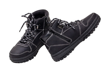 Winter boots. Close-up of a pair elegant black leather winter boots with laces and rivets isolated...