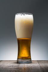Cold Craft light Beer in a glass. Close up of a pint of beer