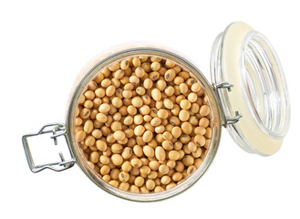 Heap of dry soybeans in glass storage jar isolated on white background top view.