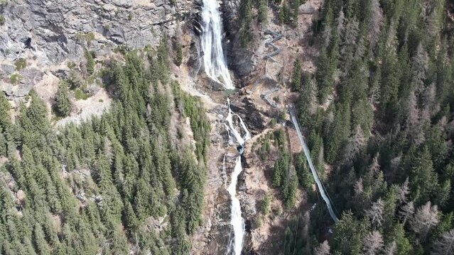 Aerial drone view of a cliff waterfall in the Tyrol