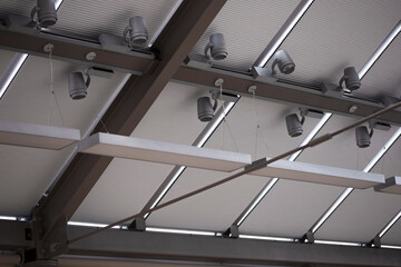 Motorized pleated blinds on the roof windows. Cellular blinds for skylights, beige color. Honeycomb...