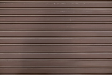 The background of the metal wall is painted brown to use as a shop wall and decorated with brown to make the space look charming and can also be used as an area for text space for advertising.