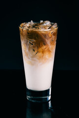 ice coffee with milk on dark background