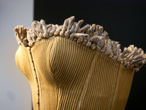 Azzedine Alaia, "prêt à porter" collection : Yellow summer bustier with rope fringe worn with shorts