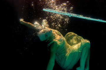 Model underwater with flute floating